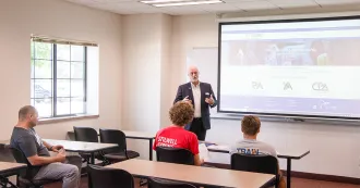 Jeff speaking at Portage campus