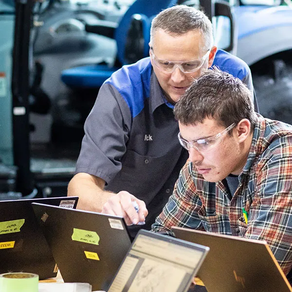 Agriculture tech student receiving 1-on-1 attention from instructor