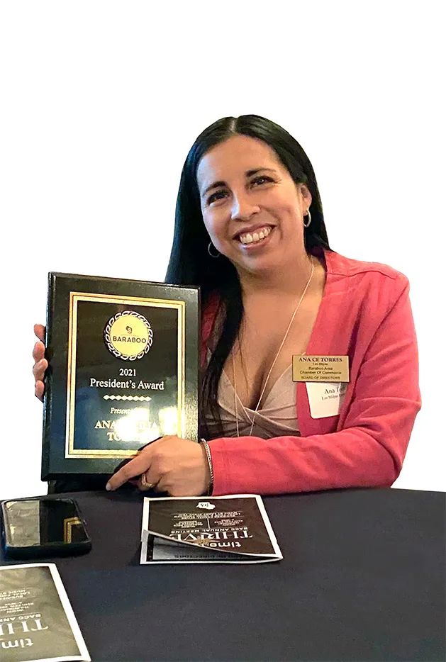 Ana receiving an award