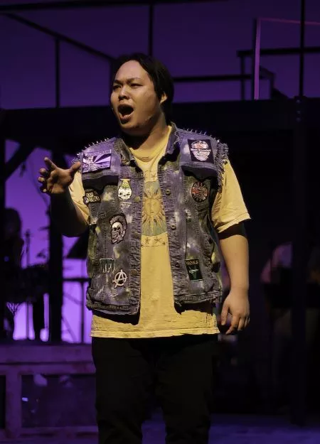 Brandon Aroonsavath in the role of Drew at a"Rock of Ages" dress rehearsal.