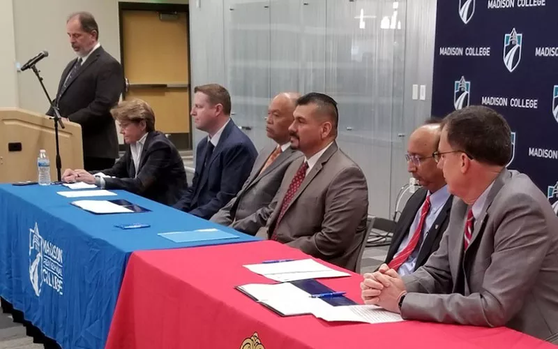 business transfer agreement signing event photo