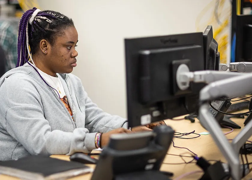 IT student working in the Introduction to Cloud Computing class
