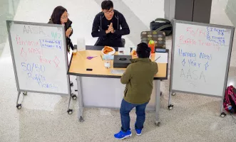 AASA Club students hosting a 50/50 raffle