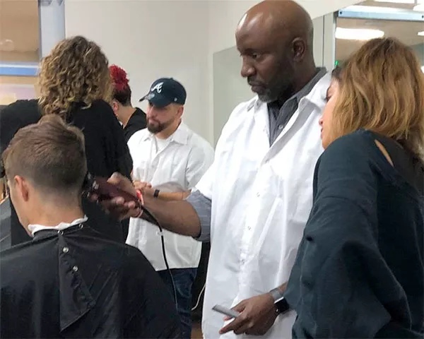 cosmetology instructor working with students