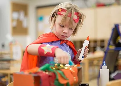 Child in hero costume
