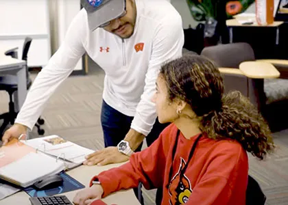 a teacher explaining a new concept to a student