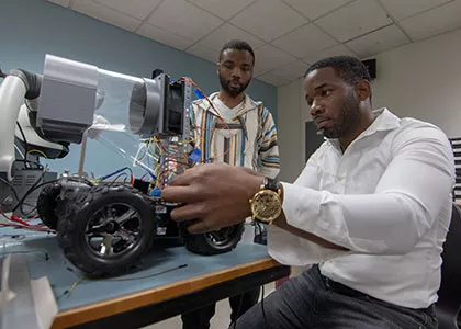 Electronic Service Technician Image of Student in the Lab