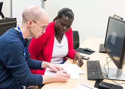 Tutor working through homework with student