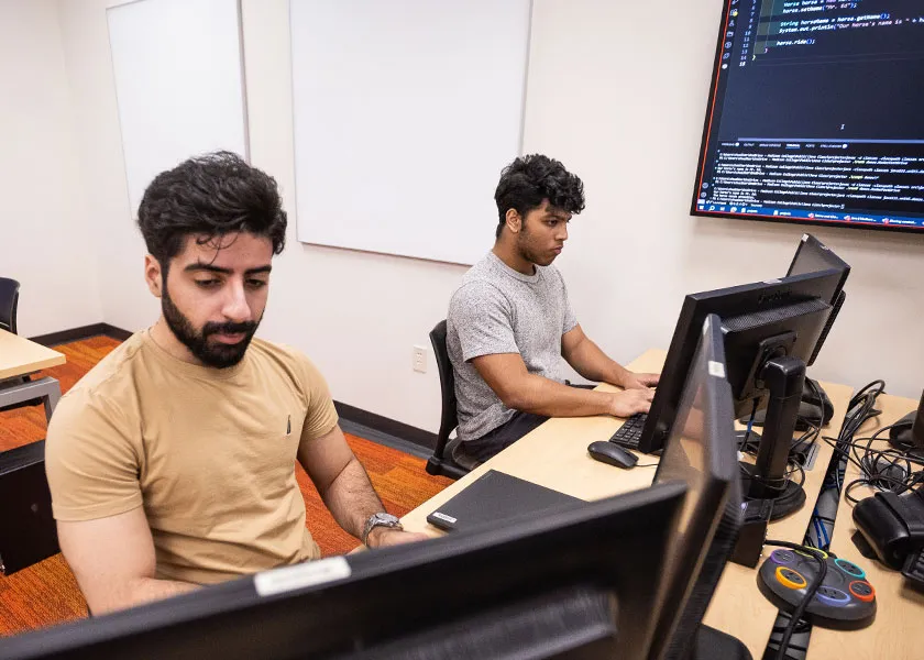 Madison College web developer students coding in class