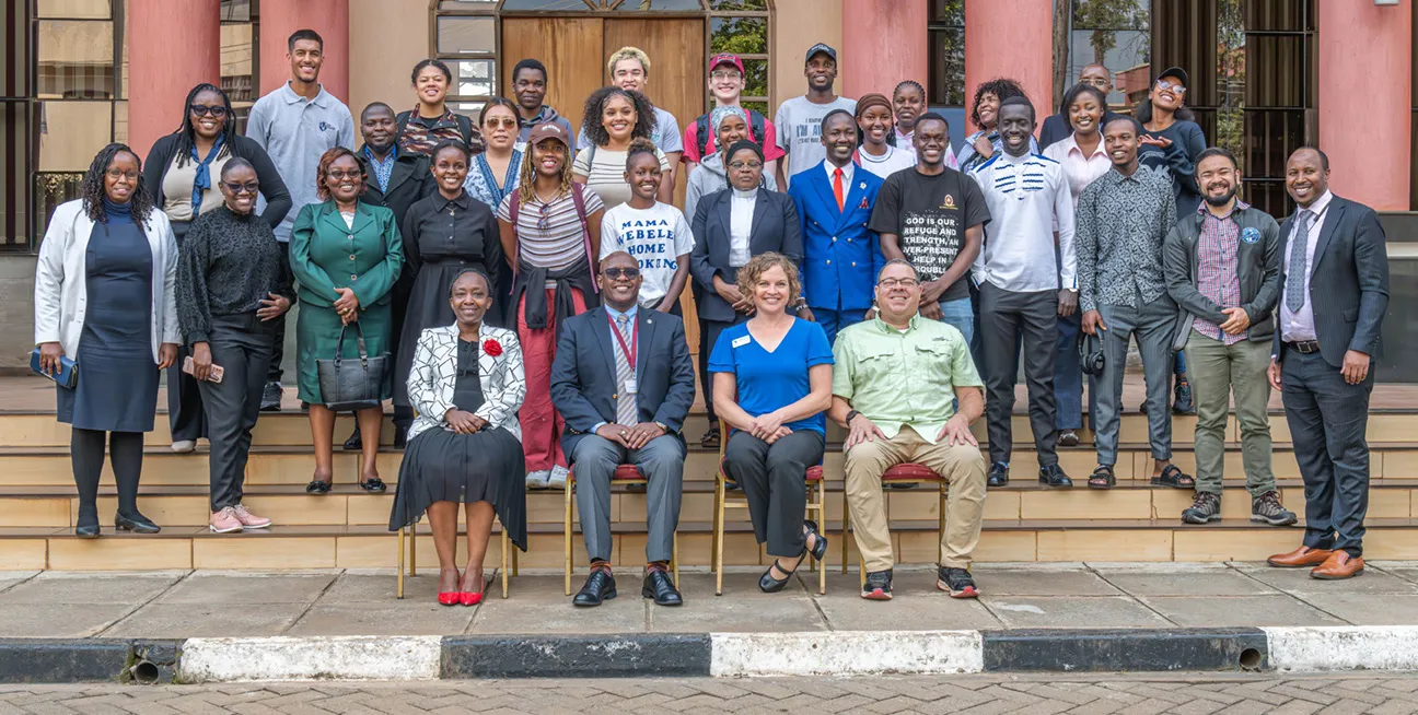 Student group posing in front of Saint Paul's University