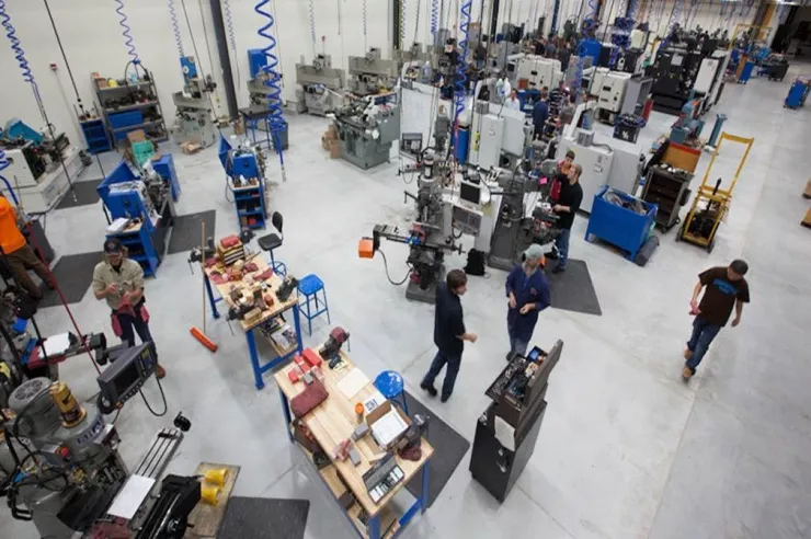 Overhead shot of students working in an automation lab.