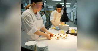 Culinary students in the kitchen making a dessert.