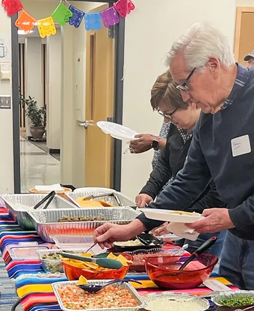 Community members at Spanish-speaking pot luck event