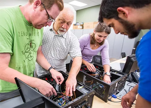 information technology students upgrading computing hardware
