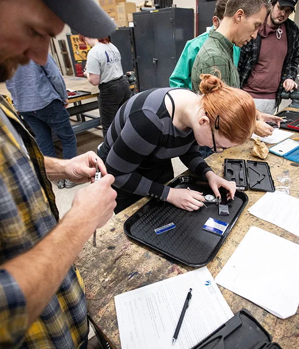 engineering students learning to use micrometers