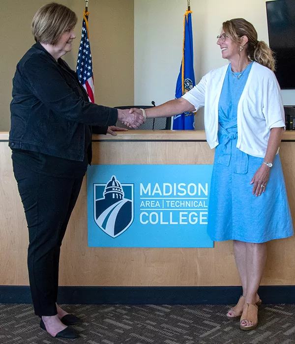 legal studies articulation agreement signing handshake