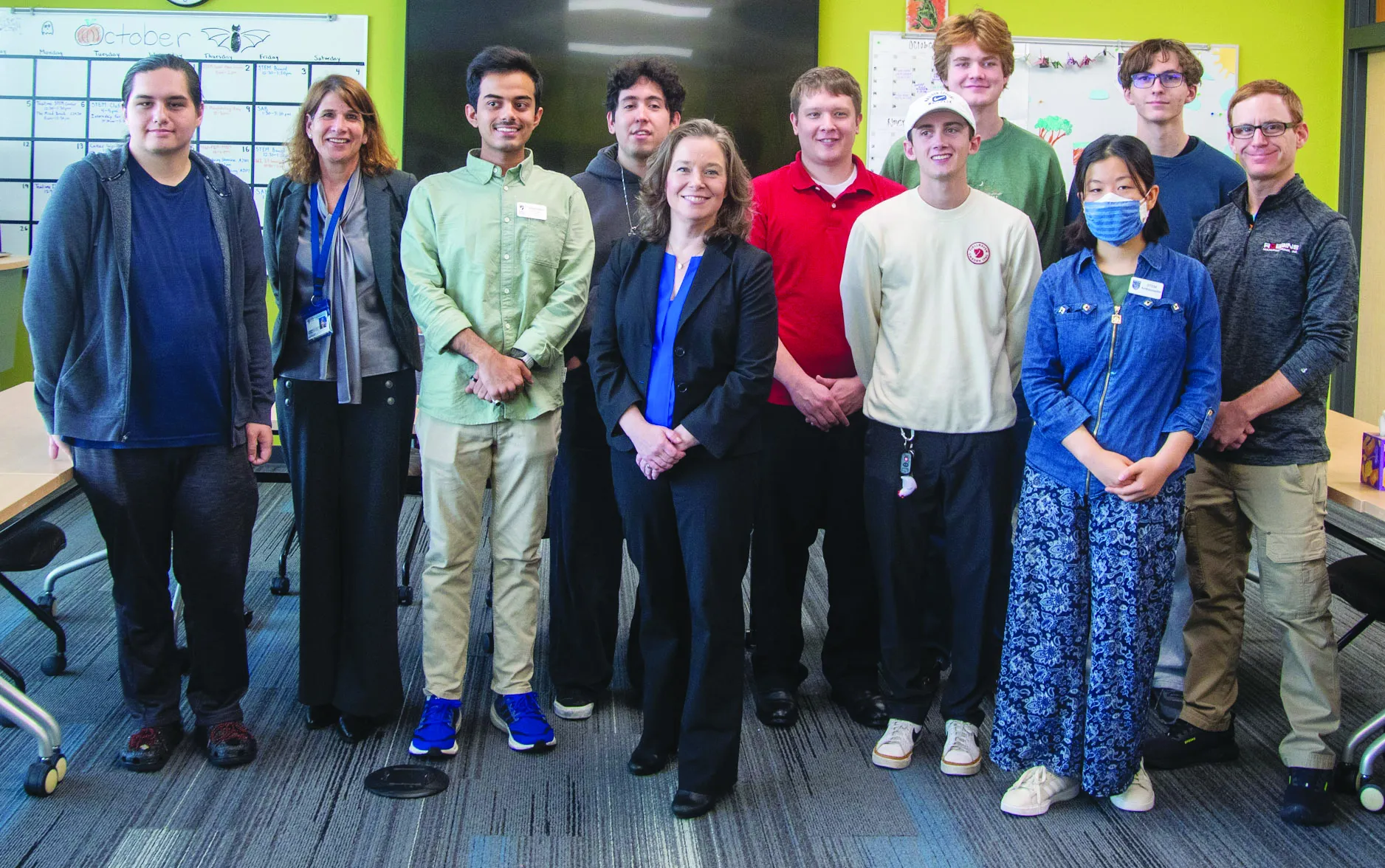 Lt. Gov. Sara Rodriguez posing with students in the Stem Center at Madison College Truax campus.