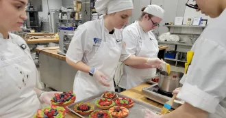 Madison College Baking & Decorative Arts Program students making fruit tarts.