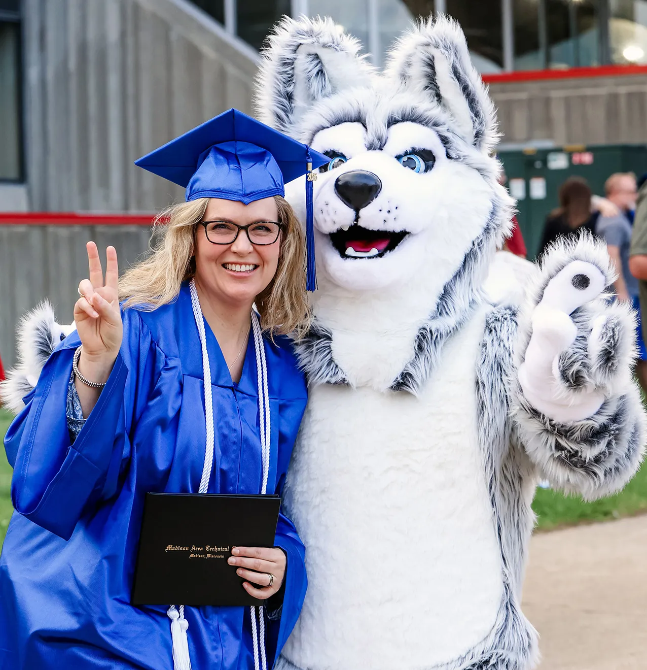 2025 spring grad with Wolfie