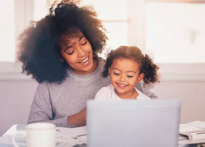 an administrative professional working remotely with a child