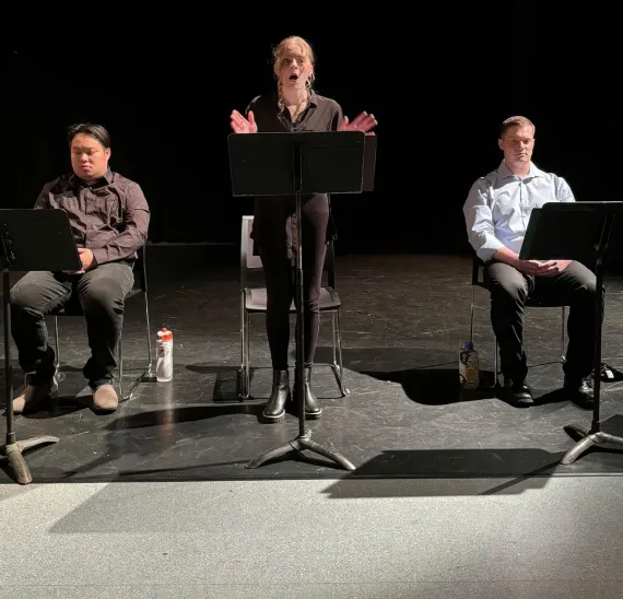 Student reading from a music stand
