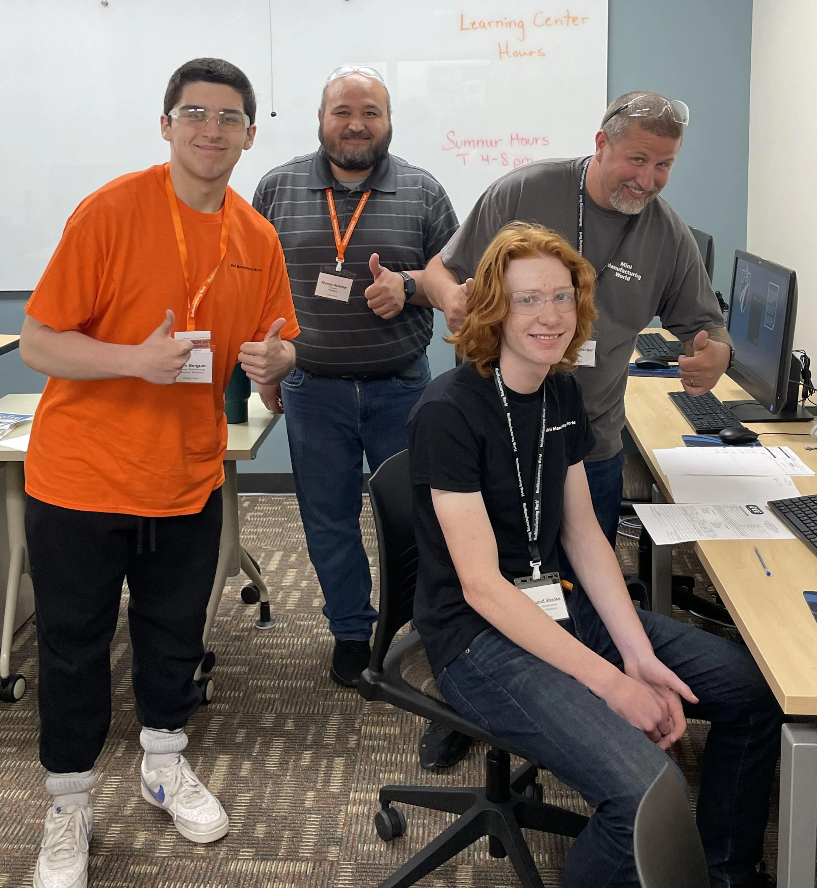 Student participants in Mini Manufacturing World event at the Portage campus pose for a photo.