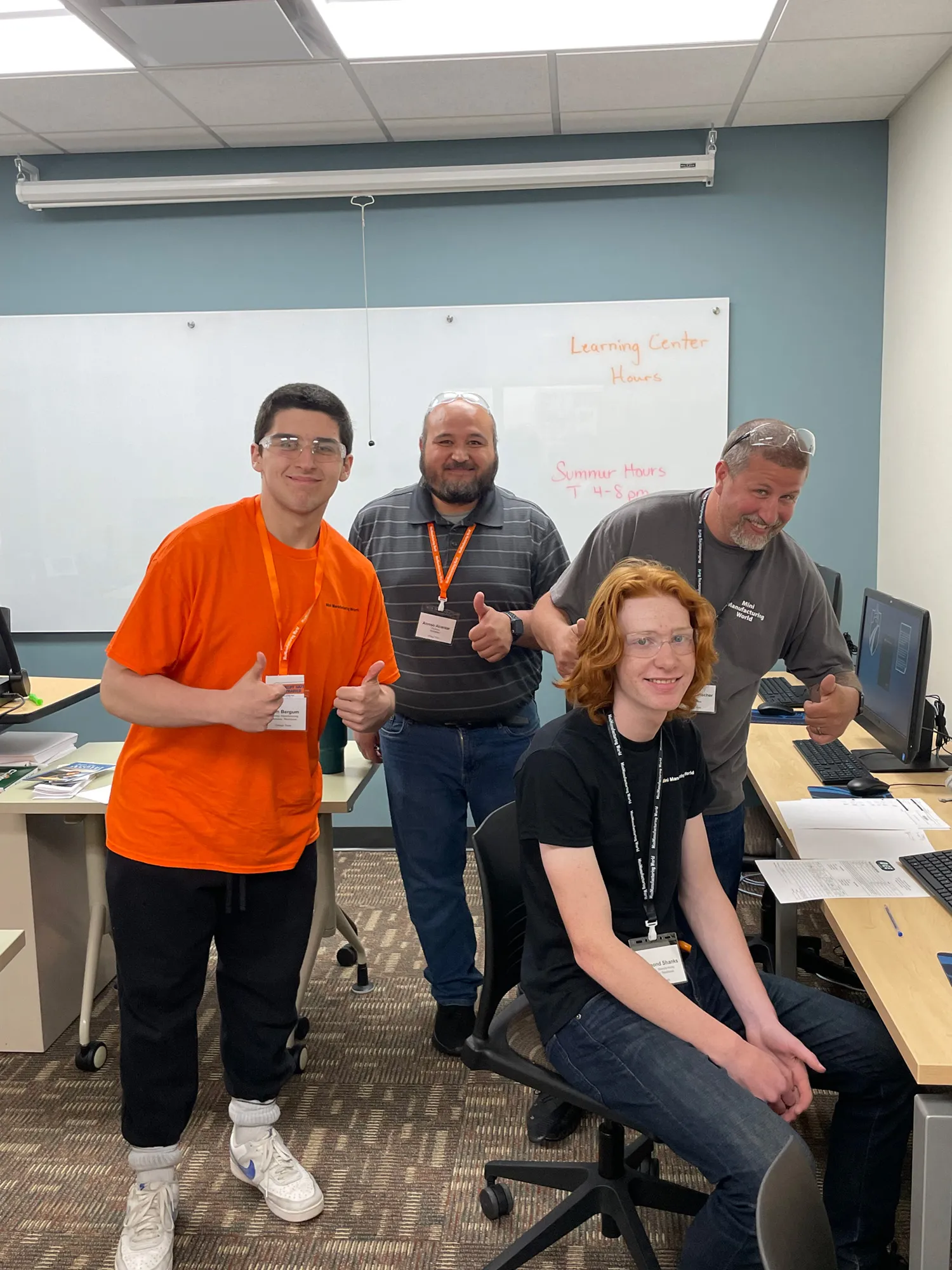 Students attending mini-manufacturing camp smiling for the camera