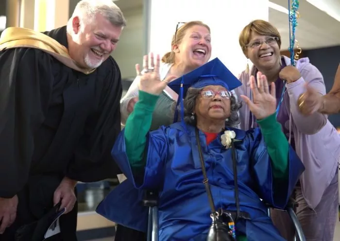 Sarah Wells celebrates graduation day with her favorite Madison College instructor Tony Cina.