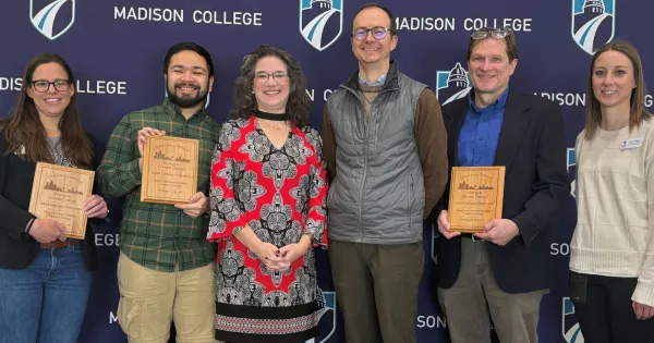 Madison College staff, faculty and students celebrate the Climate Champions award with Dane County Executive Melissa Agard.