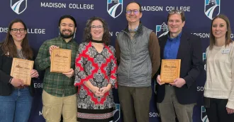 Madison College staff, faculty and students celebrate the Climate Champions award with Dane County Executive Melissa Agard.