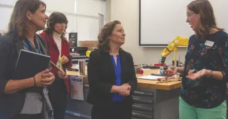 Lt. Governor Sarah Rodriquez speaks with a faculty member as President Jennifer Berne looks on.