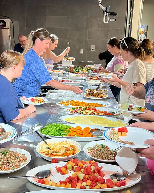community members enjoying food at a noncredit cooking class