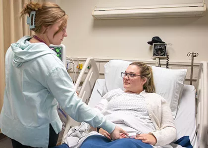 nursing student applying newly-learned techniques on clients in clinical settings