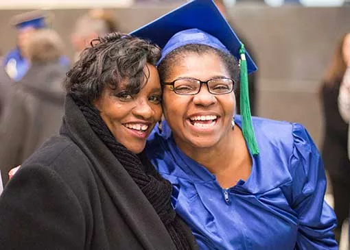 new graduate celebrating with a family member