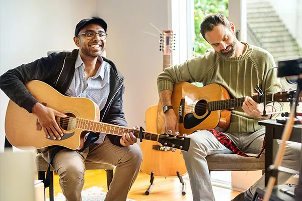 students taking guitar lessons