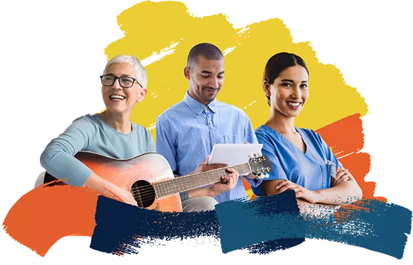 three people, one with a guitar