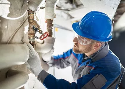 person working on pipes