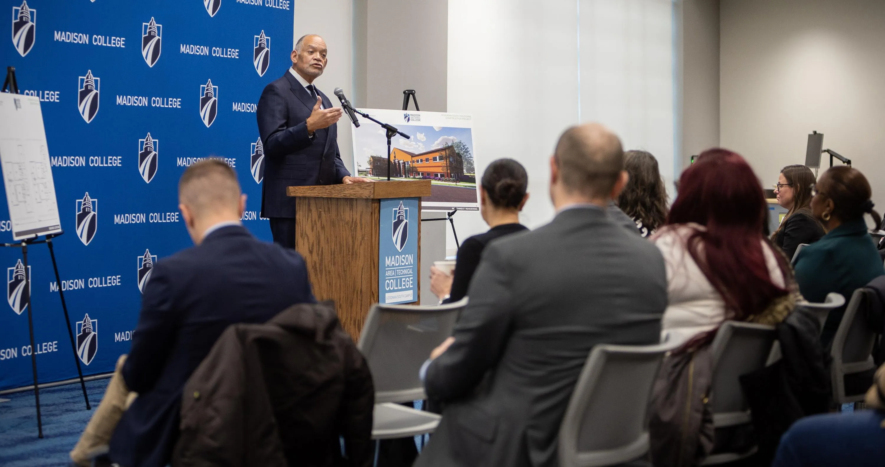 President Jack Daniels at a podium speaking to audience members during the Dec. 10 celebration.