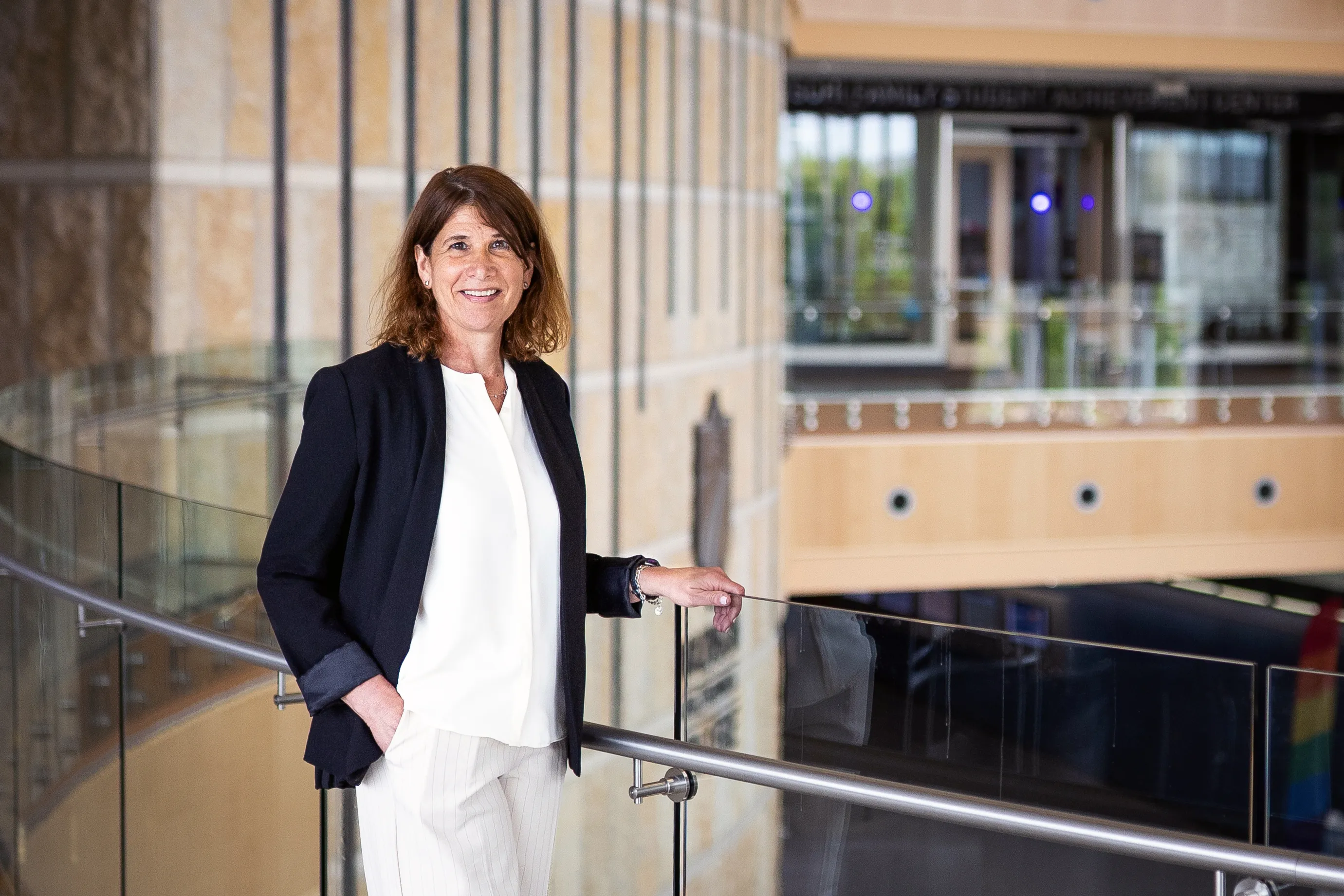 President Jennifer Berne at the Truax campus, wearing a dark blazer, white shirt and beige pants.