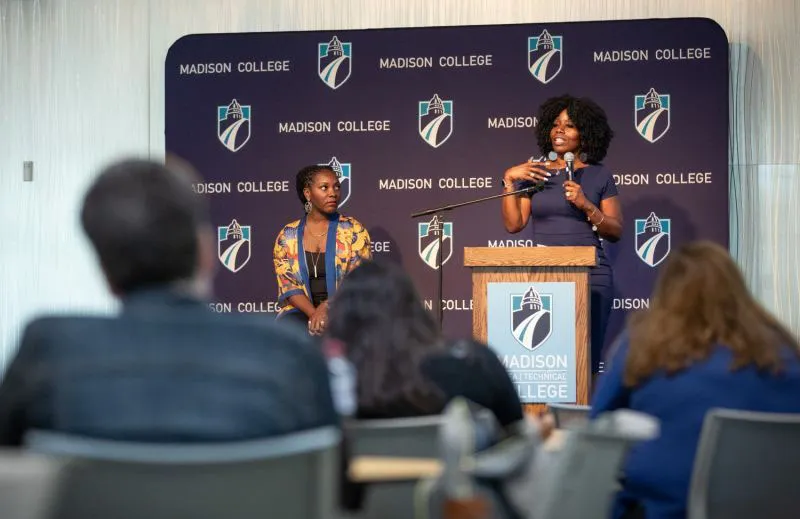 Dr. Michele Turner speaks at a podium during the Racial Equity Summit event.