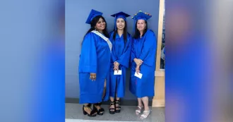 Three Madison College graduates celebrate on May 23.