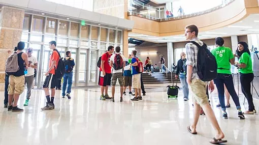 students walking inside Truax campus