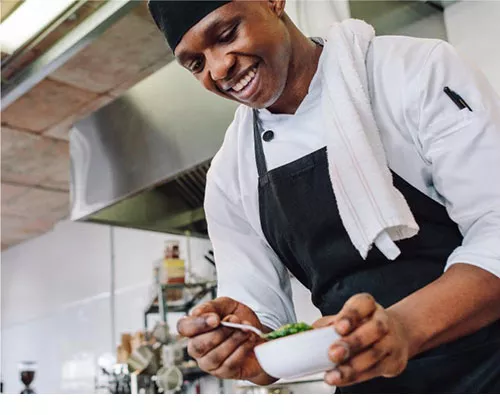 chef plating food at Taste of Madison