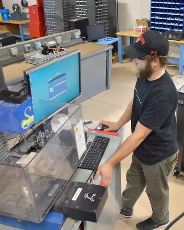 student working with a hi-tech machine