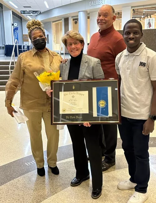 Dr. Turina Bakken with Dr. Jack Daniels and Phi Theta Kappa members