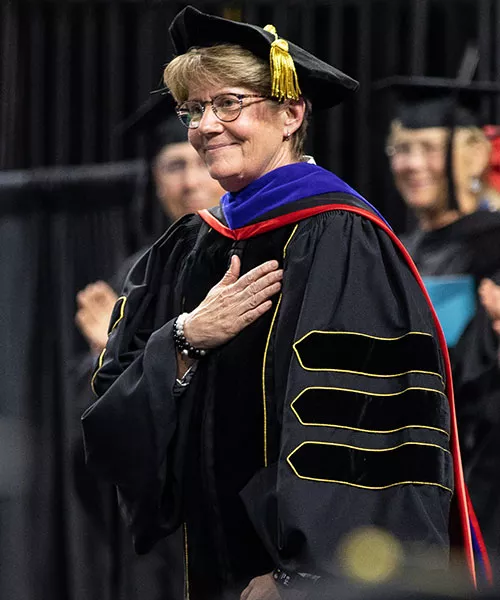 Turina Bakken in regalia at graduation