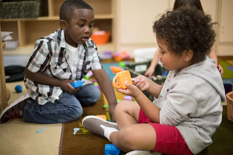 two toddlers playing