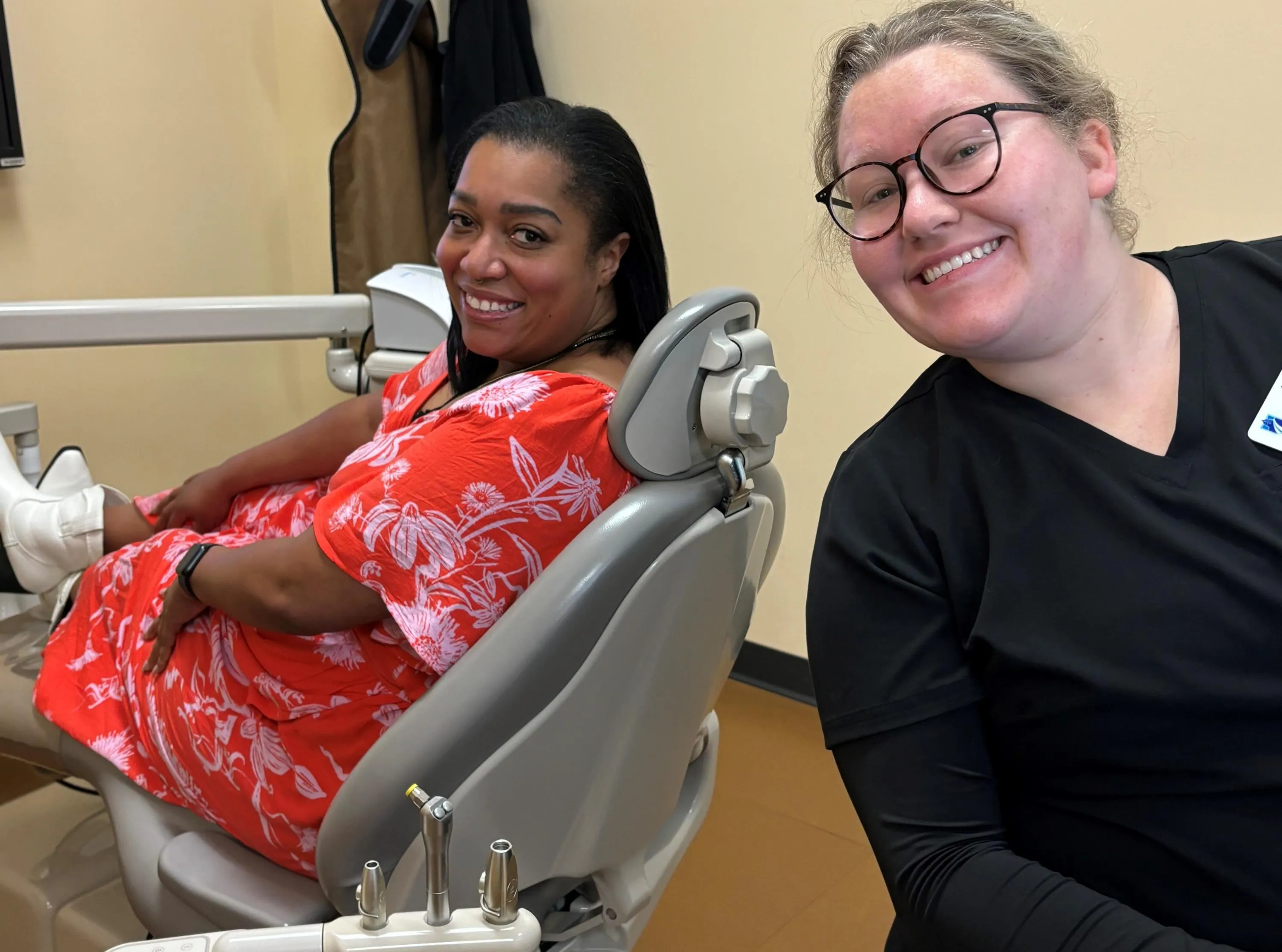 Madison College dental program student helps a veteran with a free dental check-up.