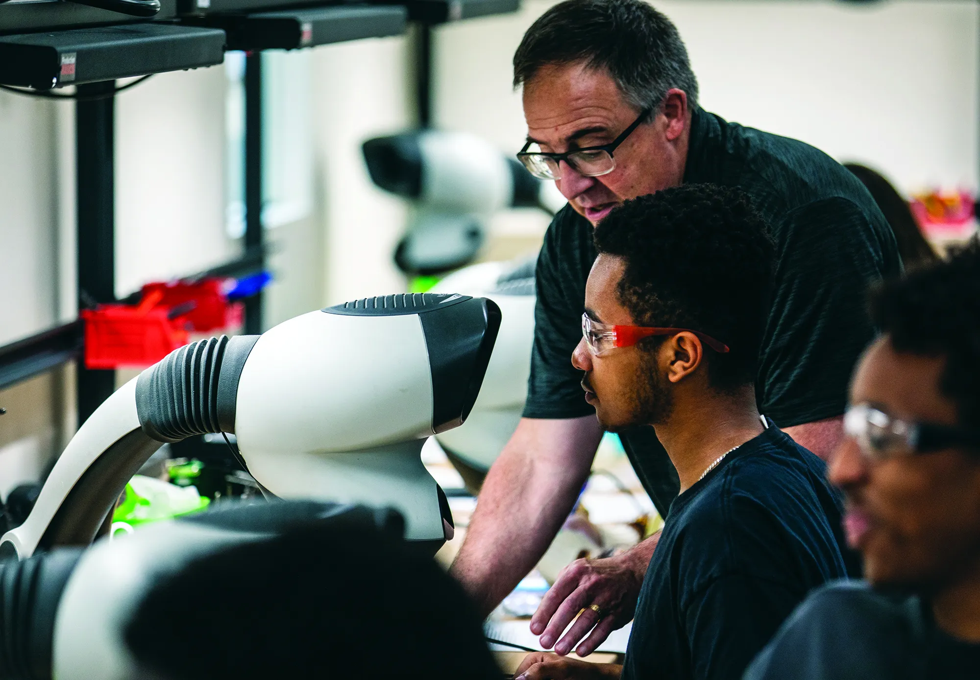 Student Yoni Abuchu consulting with instructor.